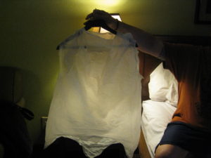 the white garbage-bag jacket Derek made for me hangs on a hanger