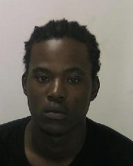closeup of young black man trying to look menacing