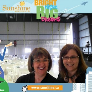 Event organizer Sheila Harrison and I pose in front of the decorated hangar for the in-house photo machine