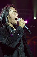 close-up of Arnel Pineda singing with Journey