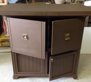 cabinet is now all the same colour, deep brown, and the three pieces of hardware all match