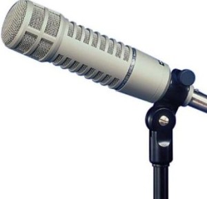 long, silver RE-20 microphone on a mic stand