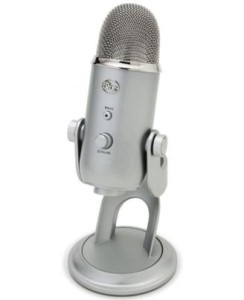 silver, Yeti Blue mic is fat, sits upright on its own stand, and has a couple of dials on the front of it