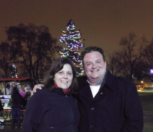 My buddy Eric and I posing in front of a Christmas tree, nighttime, Victoria Park, London