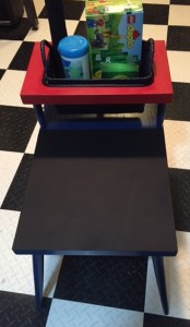 Play table in red and blue with black chalkboard surface
