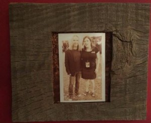 barnboard with a cutout for a 5 x 7 photo. Wood has natural, little splits and knots in it