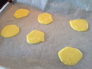 small circles of the batter on a parchment-lined baking pan