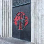 tall black iron doors with beautiful red inlay