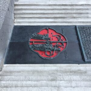 tall black iron doors with beautiful red inlay