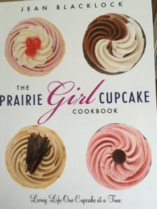 cookbook cover shows beautiful close-ups of a variety of yummy cupcakes
