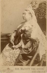 postcard that's a print of a portrait of Queen Victoria at age 77