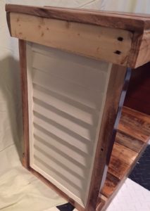 table sides have louvered panels painted off-white