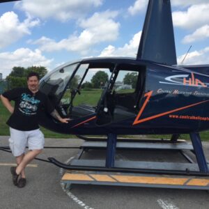 Derek leans on the chopper, back down on the ground