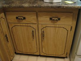 new granite-look counter top with old, dated wood-look cupboard doors still in place below it