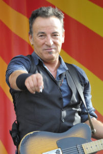 Bruce Springsteen on stage pointing to the camera