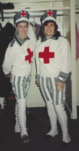 Maureen Holloway and I in our stretcher-bearer costumes with big red crosses on the chest, smiling for the camera