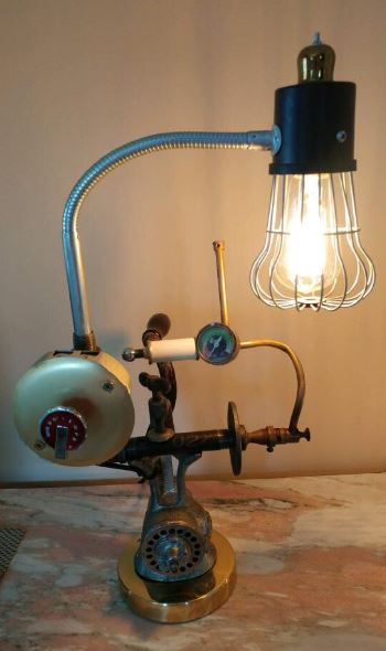 One-of-a-kind lamp with vintage features and a neck that moves. Solid base is an antique meat grinder. 