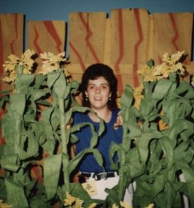 a much younger me peeking through the corn