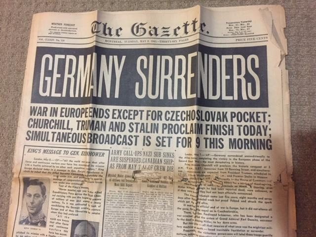 Headline of the Montreal Gazette reads Germany Surrenders, dated May 8, 1945