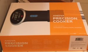 orange and white box containing an Anova Precision Cooker