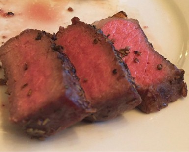 closeup of three perfect slices of steak