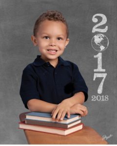 Ryker posing for his first school picture