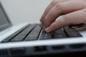 close-up of fingers on a keyboard