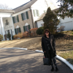 I'm in the forefront of the mansion. It's a two-story, stately home.