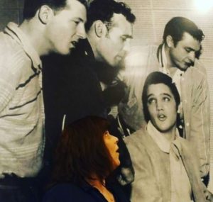 I'm pretending to harmonize in the famous photo of Jerry Lee, Carl, Elvis and Johnny on the wall of Sun Studio