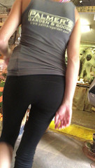 photo of a woman's backside as she wears yoga pants with a t-shirt