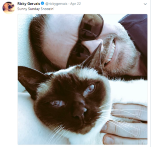 a photo of Ricky and his Siamese cat Ollie