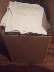 computer-sized cardboard box piled high with paper