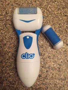 Clio foot machine looks like a bigger version of a razor and has a little attachment with foot-file sandpaper on it that spins when you power it on