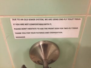 Typed little sign over the toilet paper roll explains that they use 1-ply paper because the pipes are old. But if you aren't comfortable with it, you can ask for 2-ply at the office.