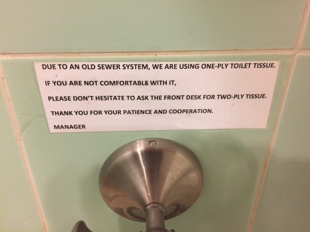 Typed little sign over the toilet paper roll explains that they use 1-ply paper because the pipes are old. But if you aren't comfortable with it, you can ask for 2-ply at the office.