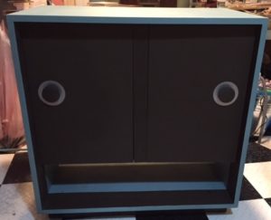 cabinet with a blue-green coating on the top and sides