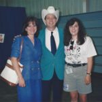 Me with Junior Brown and his wife. Jr is a small man who wears a very big hat