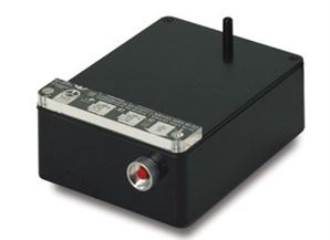 rectangular and black, with a red button on the front, the bulk eraser also has a probe on the upper right corner to hold the centre of a reel tape while it's rotated and erased