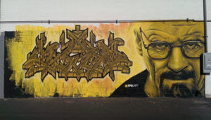 tagged concrete block wall with a perfect rendering of Walter White aka actor Brian Cranston
