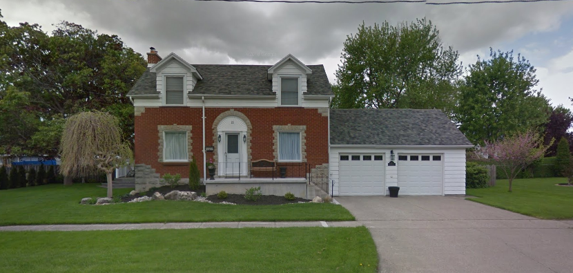 Our new place - brick front with a two car garage, two storey home. Has steel roof and dormers on the front