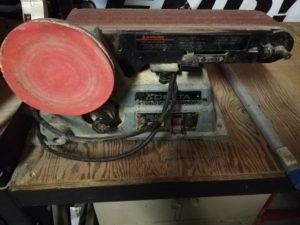 photo of a belt sander on a table