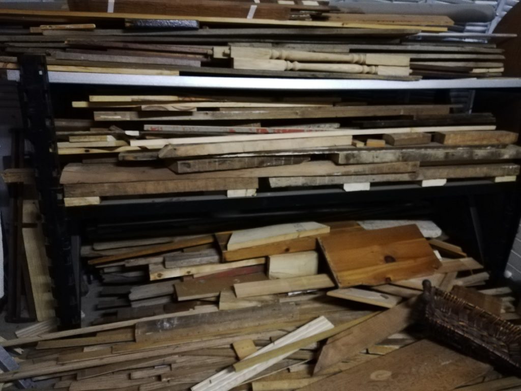 a seven-foot stack of project wood, one-third of what we gave away