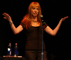 Kathy Griffin making an "uh-oh" face while performing on stage