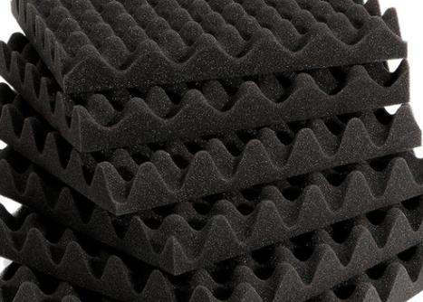 Twelve-inch squares of acoustic foam in a pile