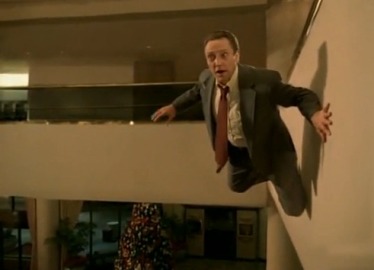 A still shot from the Weapon of Choice video where Christopher Walken appears to be floating near a hotel wall