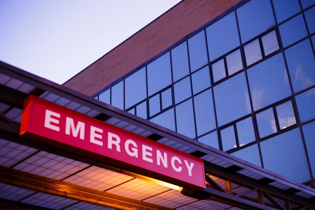 Red emergency sign on a hospital