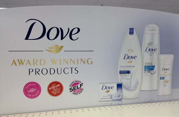 Dove product poster in-store shows soap, shampoo etc and the logo