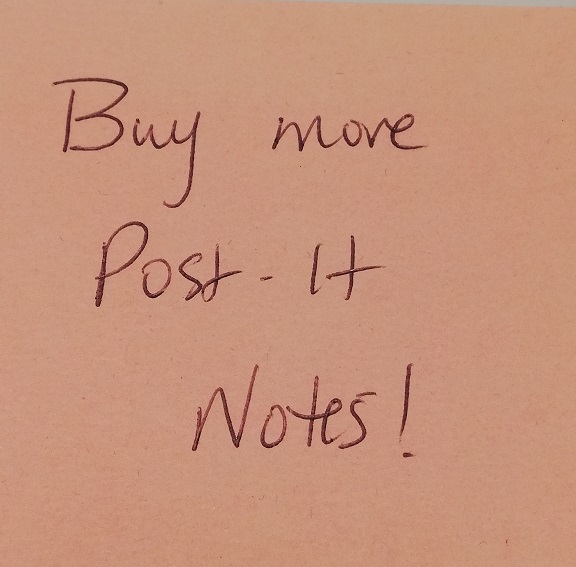 Pink post-it note on which I've written, buy more post-it notes!