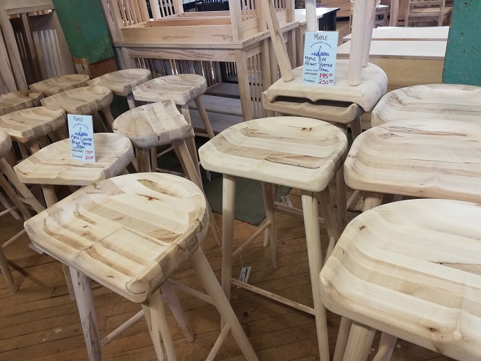 Tractor stools are wooden stools that are grooved to cradle the butt.