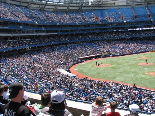 wide shot of the inside of Rogers Centre during a Blue Jay game when the stands are mostly filled